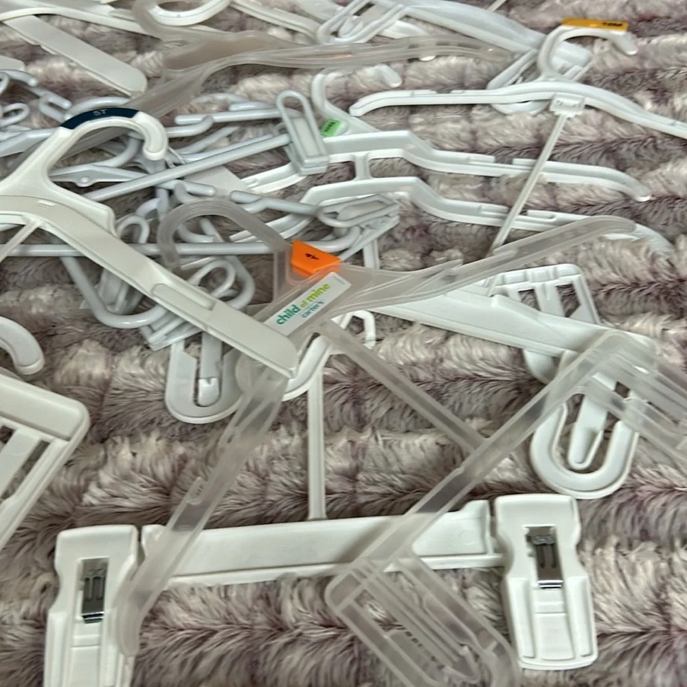 28 kids plastic hangers All white , all different